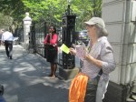 Phyllis handing out flyers to peole entering City Hall